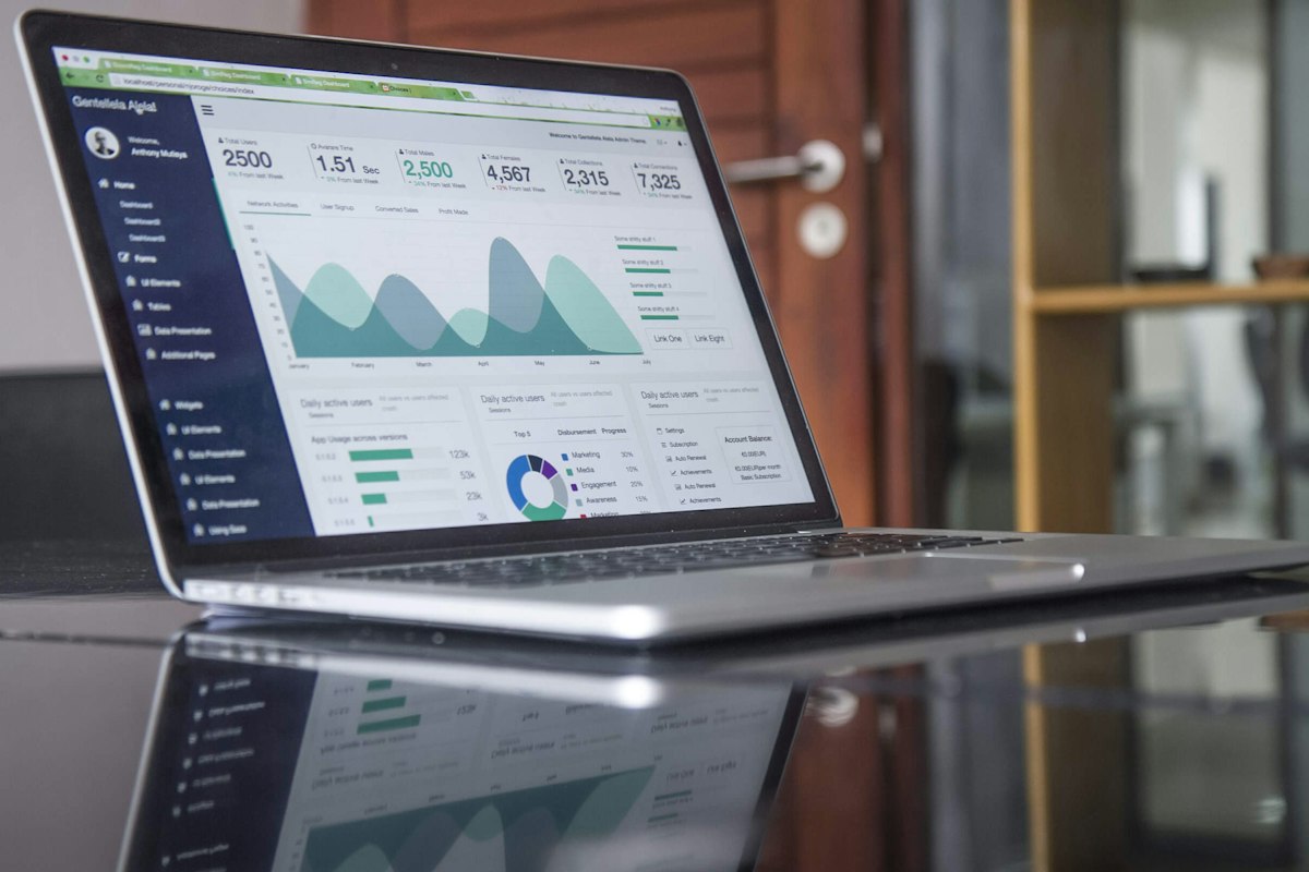 Laptop showing a reporting dashboard on a desk