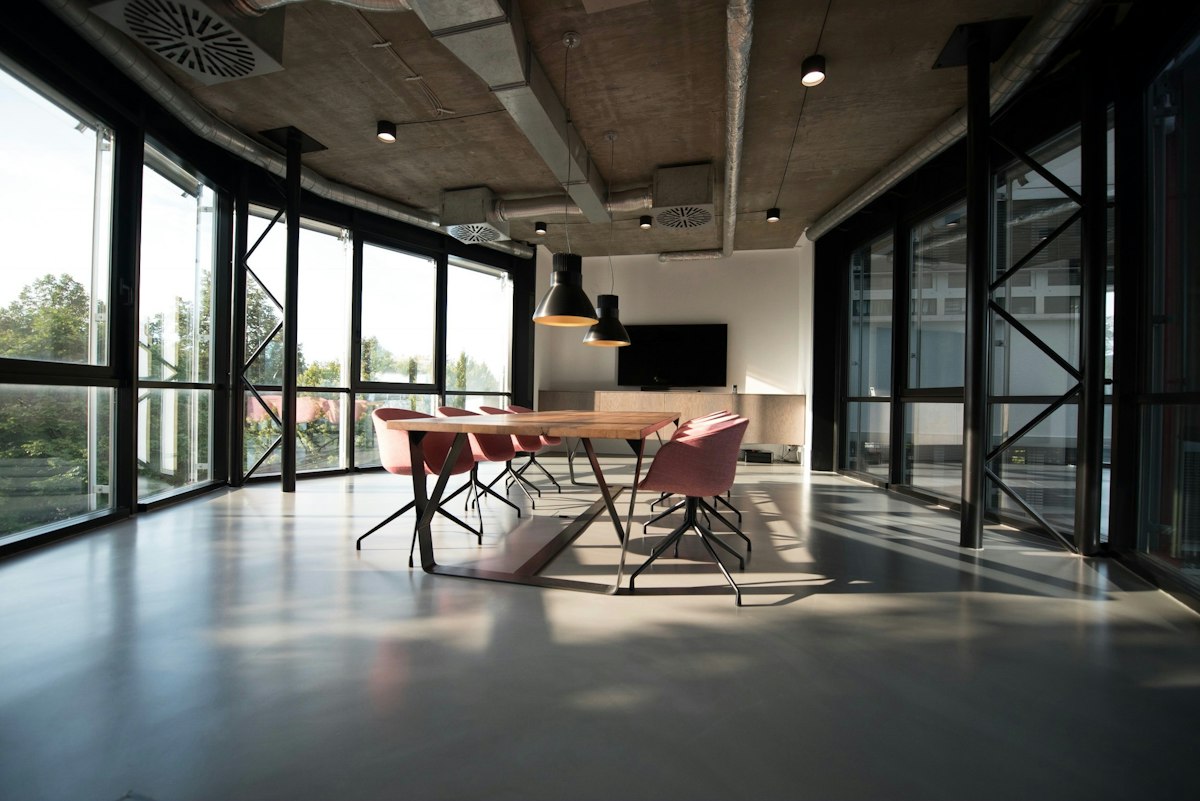 Warm conference room with wood table and natural light
